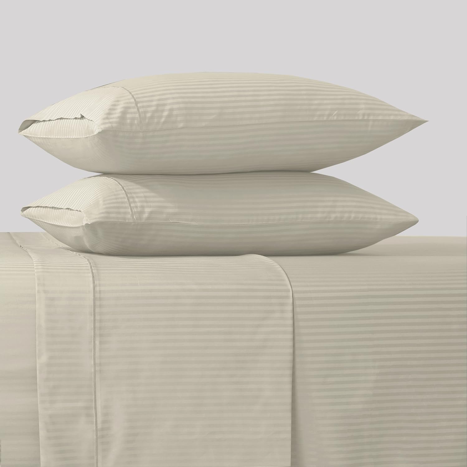 Feather & Stitch New York king fitted sheet 18-inch pocket shows secure, deep fit.