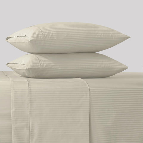 Feather & Stitch New York king fitted sheet 18-inch pocket shows secure, deep fit.