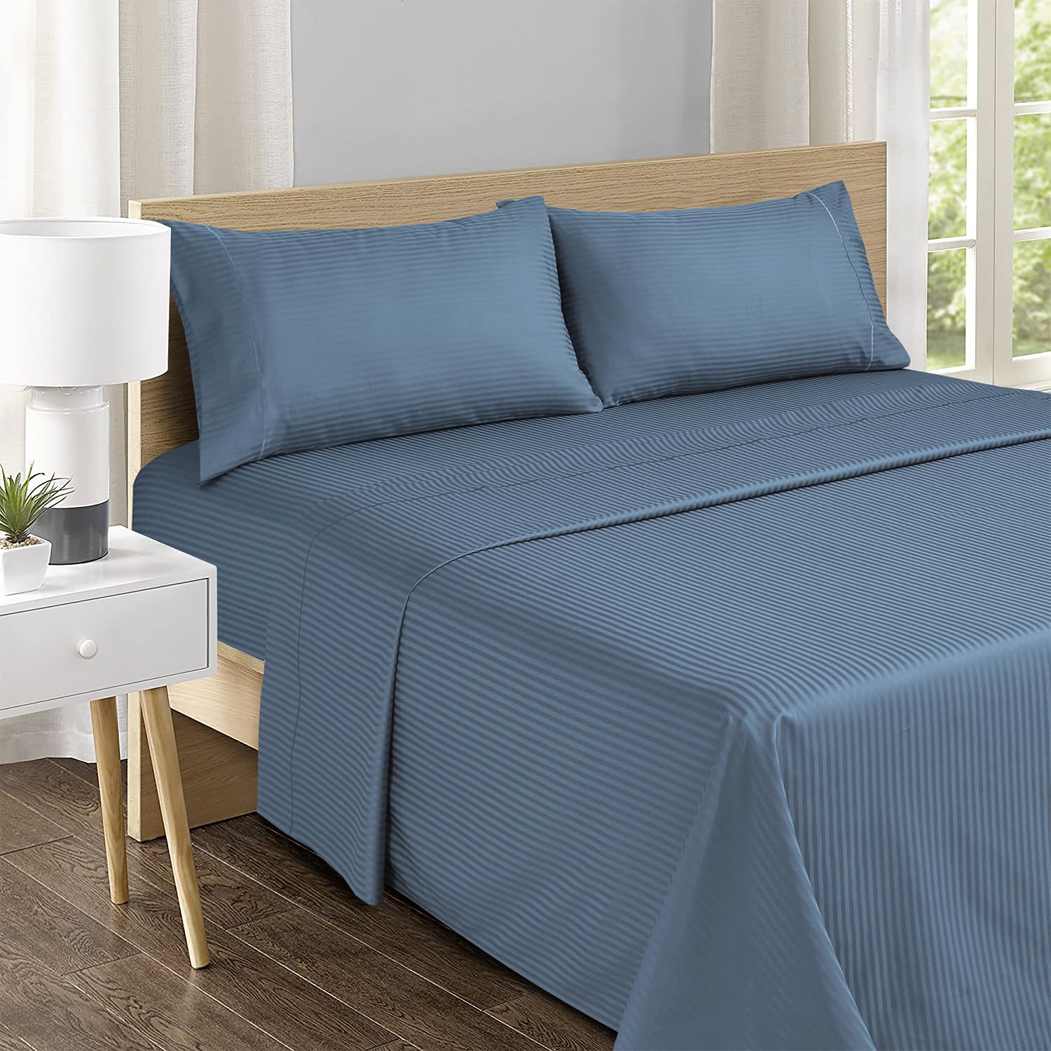 Feather and Stitch New York pillowcases with elegant embroidery for refined bedroom luxury.