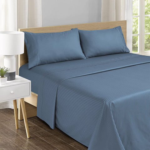 Feather and Stitch New York pillowcases with elegant embroidery for refined bedroom luxury.