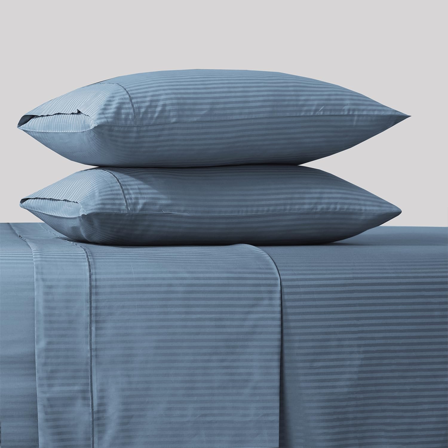 Feather and Stitch New York queen damask bedsheet set flat view with blue stripe.
