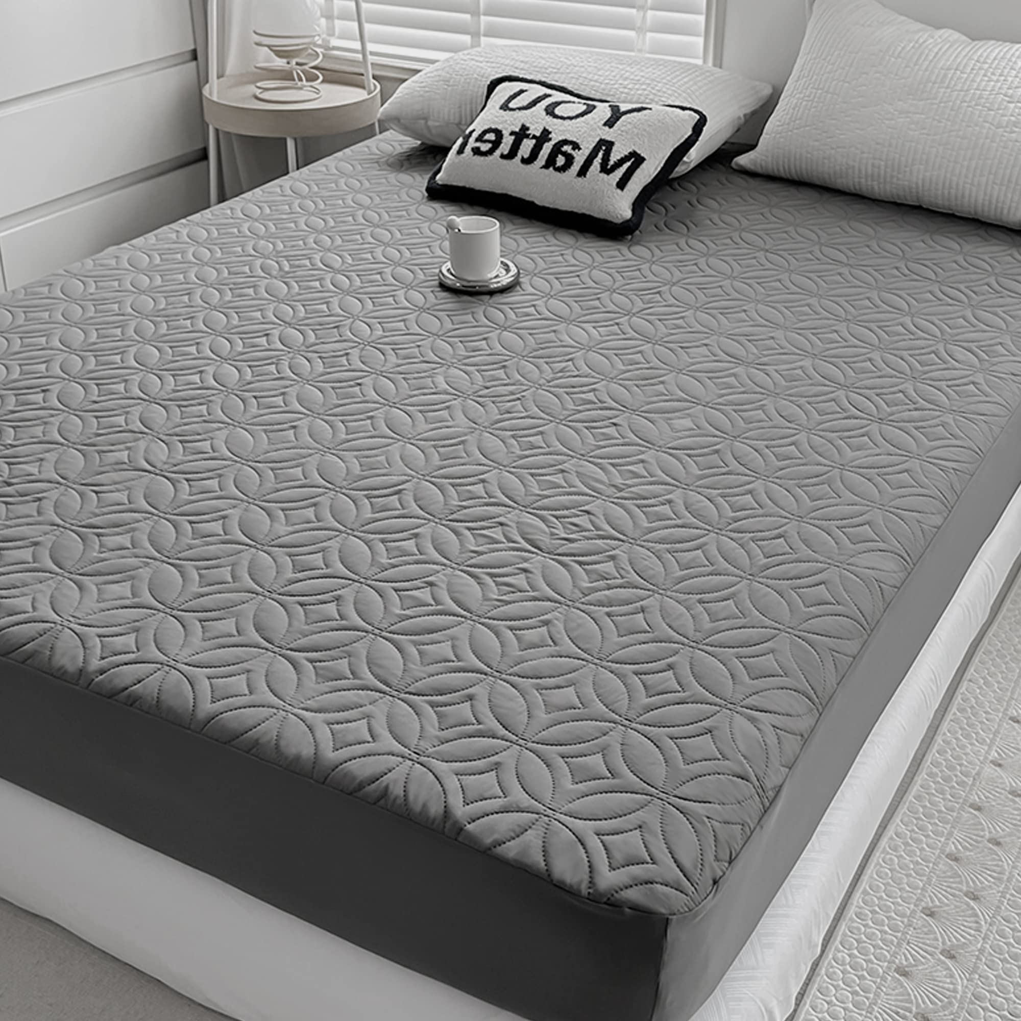 FELTYBED full-size waterproof mattress protector guarding a 54x75 bed against spills