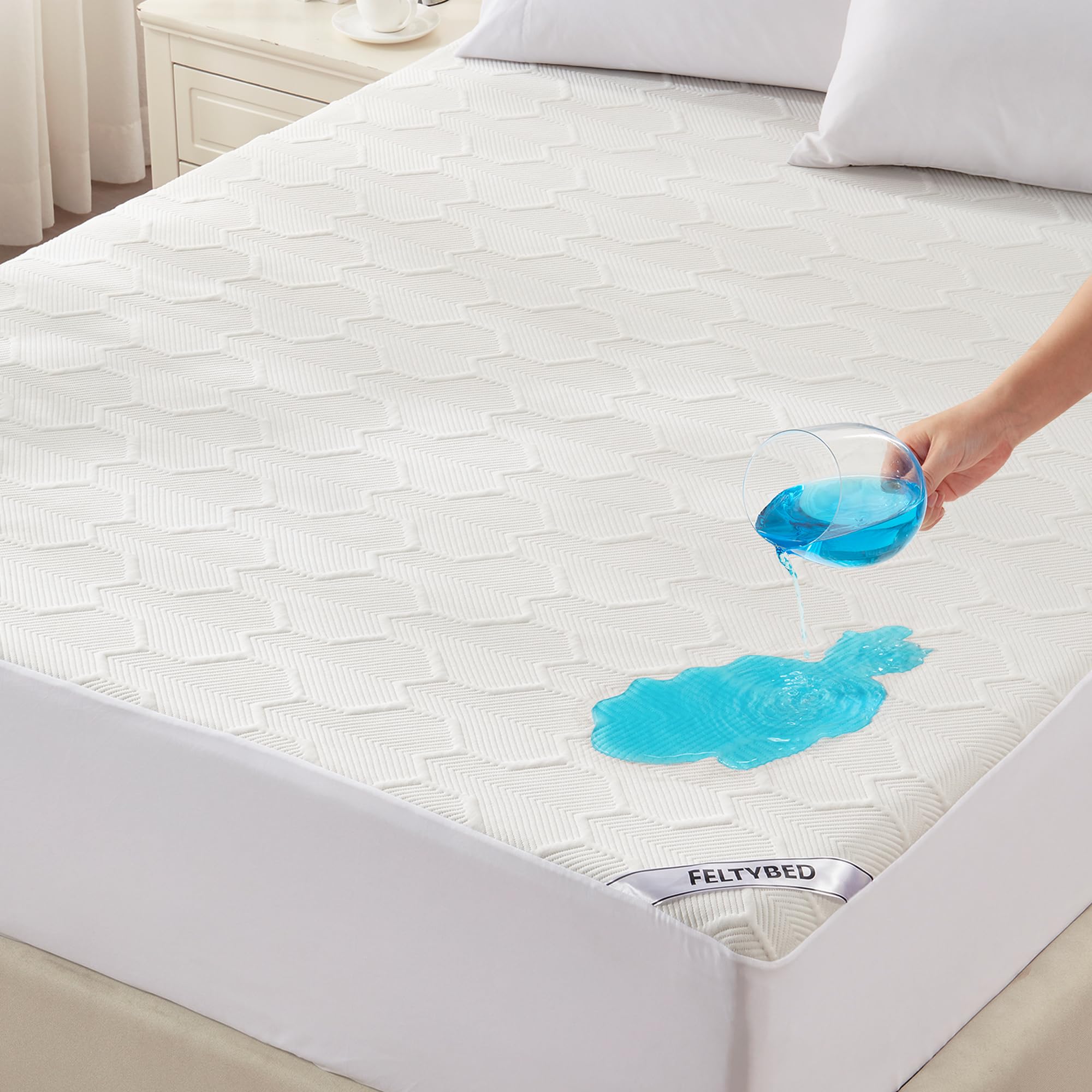 FELTYBED queen-size waterproof mattress protector securely protecting the mattress from spills