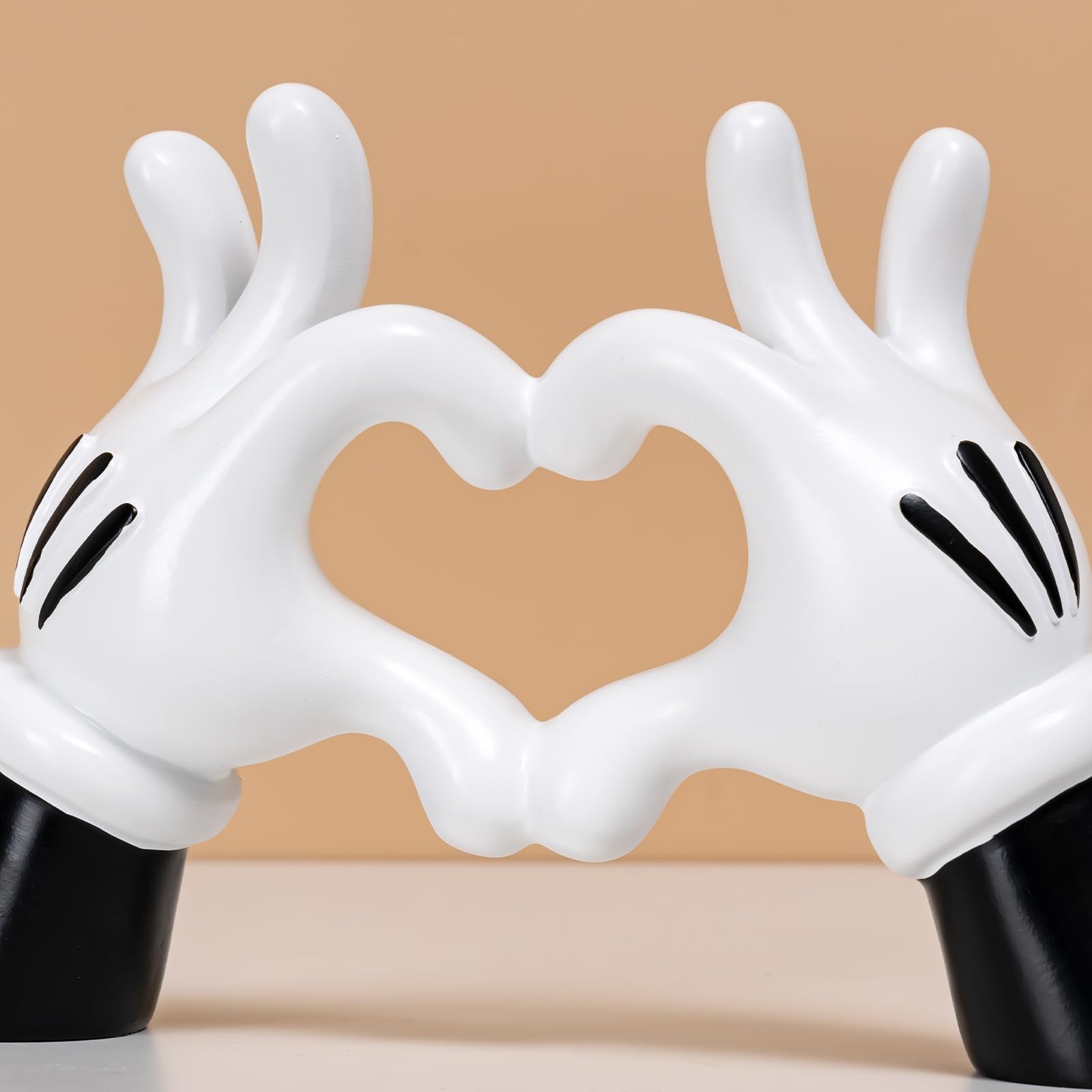 FelyHos modern home decor accent brings whimsical heart gesture to any room.
