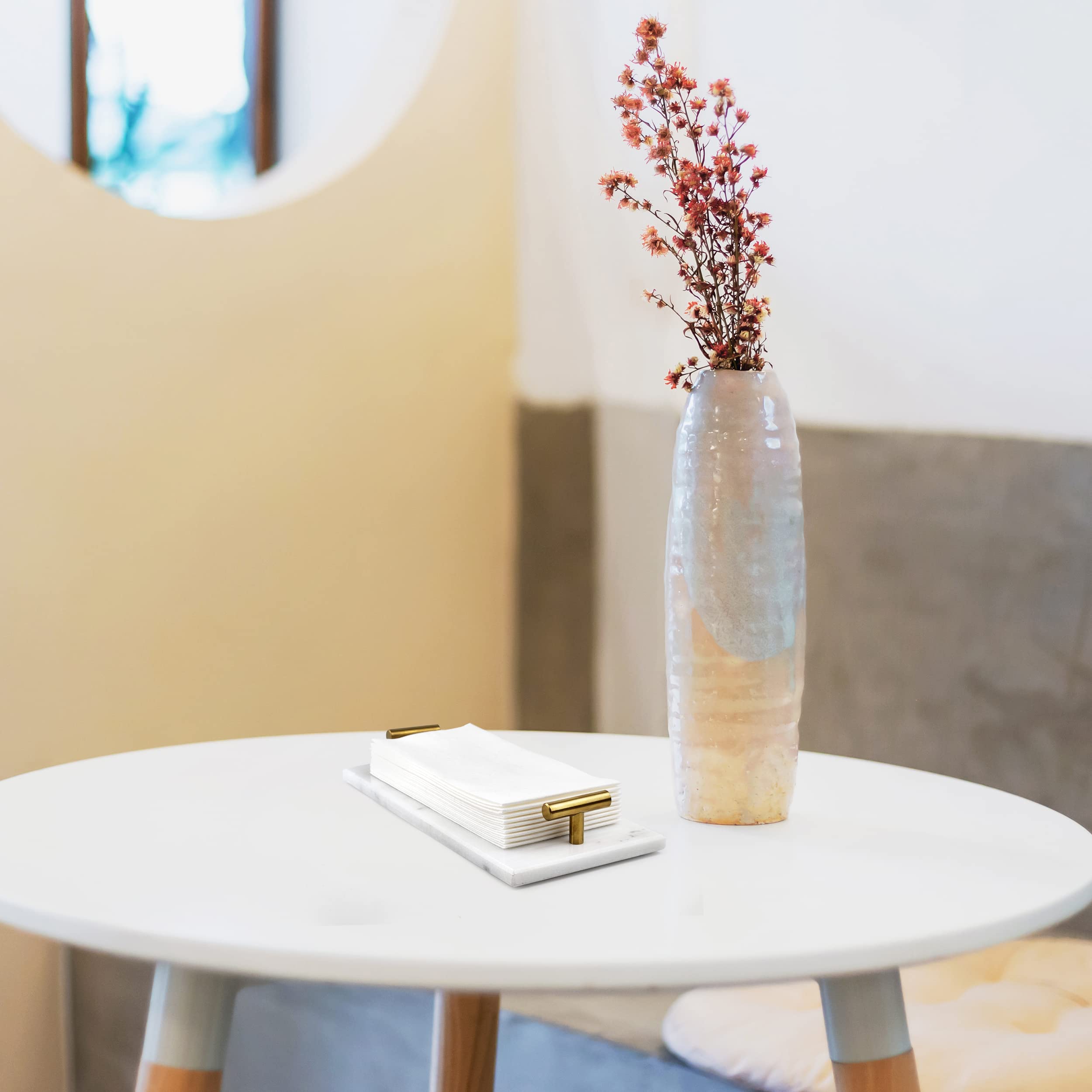 Fete space-saving tray consolidates towels in one stylish location.