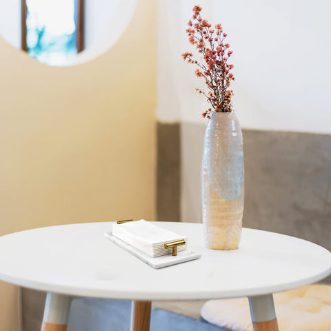 Fete space-saving tray consolidates towels in one stylish location.