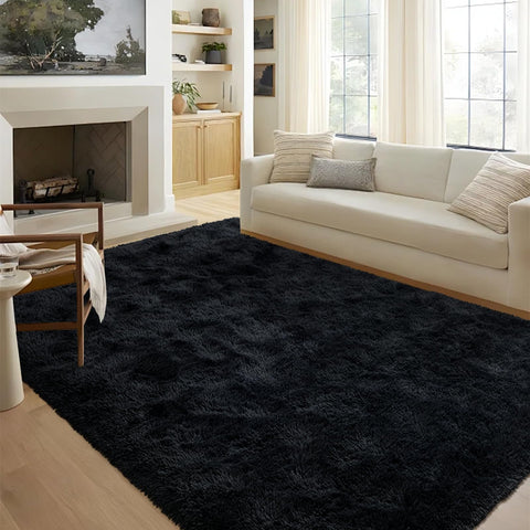 FinRèc Home 5x8 black shag rug adds cozy style to your living room.