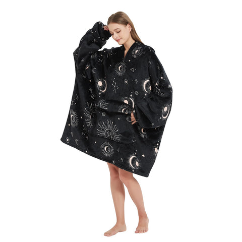 Fiosnow sun and moon blanket hoodie in use for couch lounging and outdoor events.