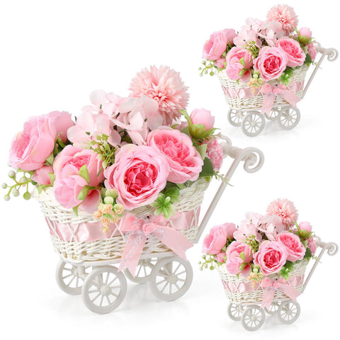 Fiwochic pink flowers and rattan add texture and warmth.
