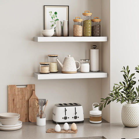 Fixwal white shelves in bathroom offer easy-access storage.