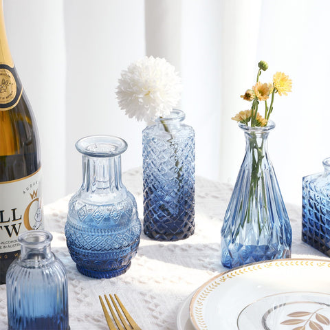 Fixwal window sill display with blue bud vases for natural light