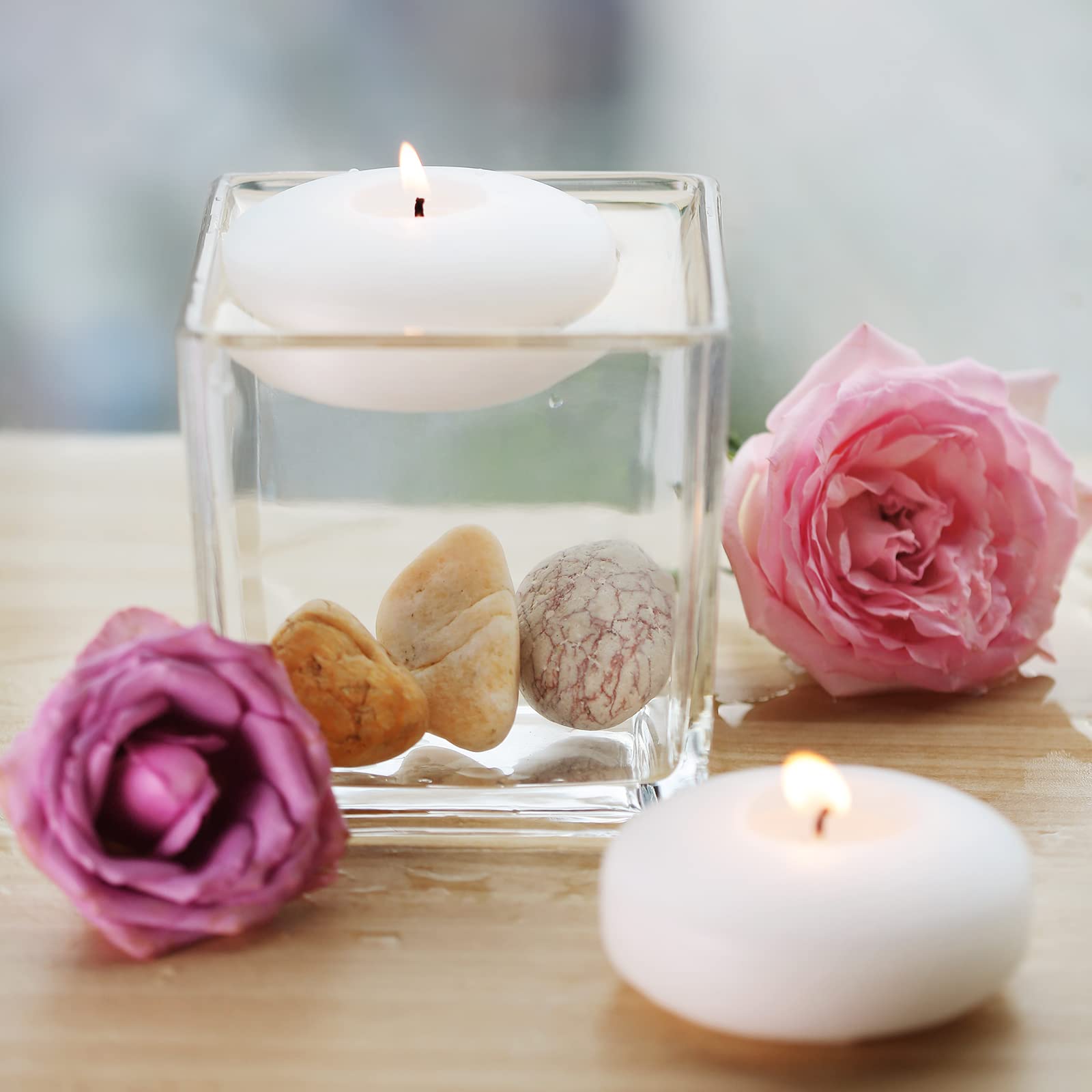 Flamecan cylinder-vase floating candles provide warm, steady decor light.