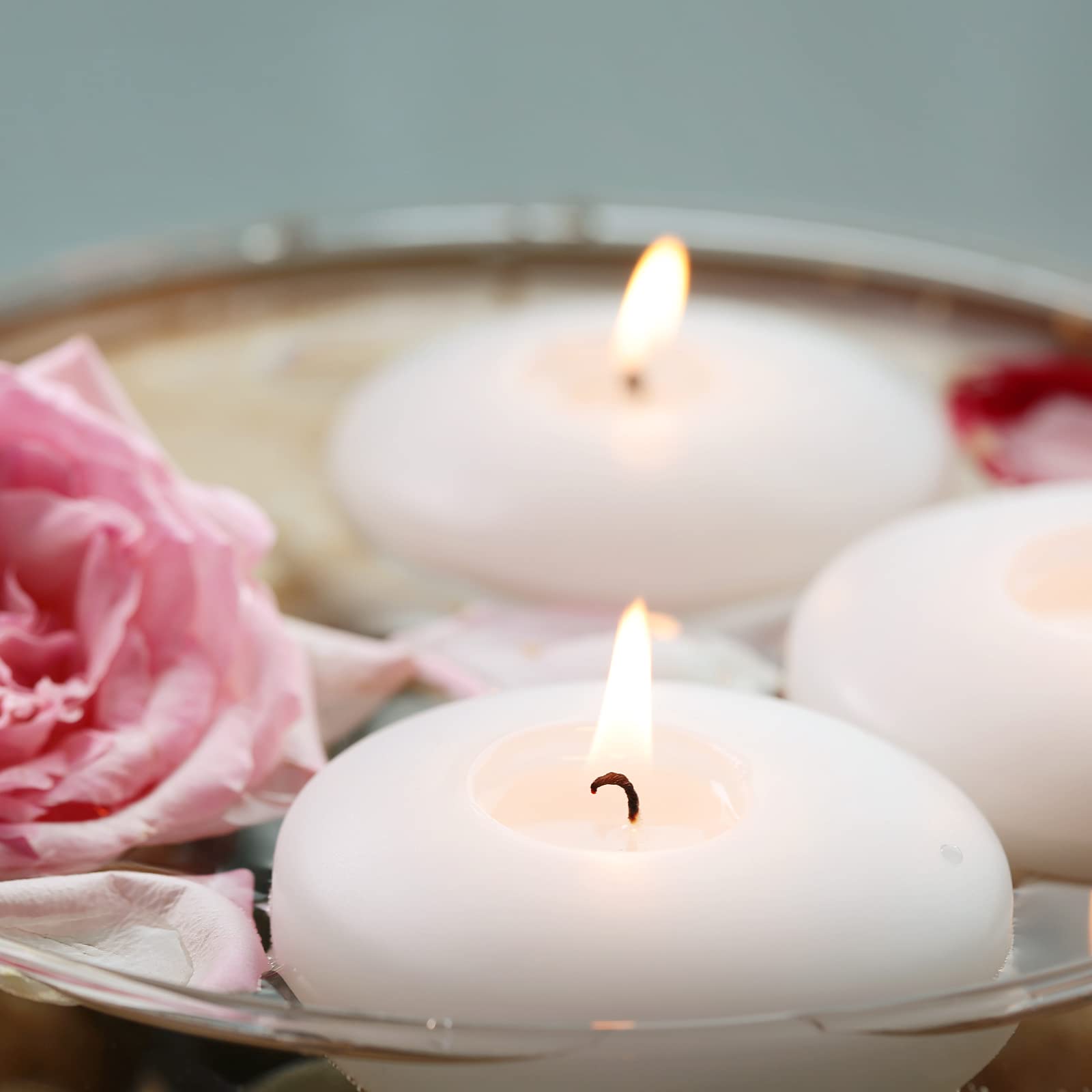 Flamecan wedding-reception floating candles add romantic glow to centerpieces.