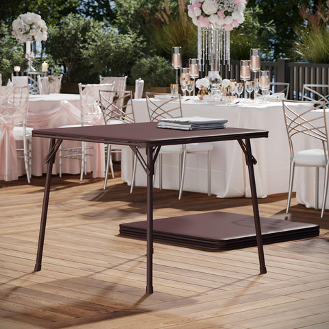 Flash Furniture Madelyn portable brown folding table in use for events.