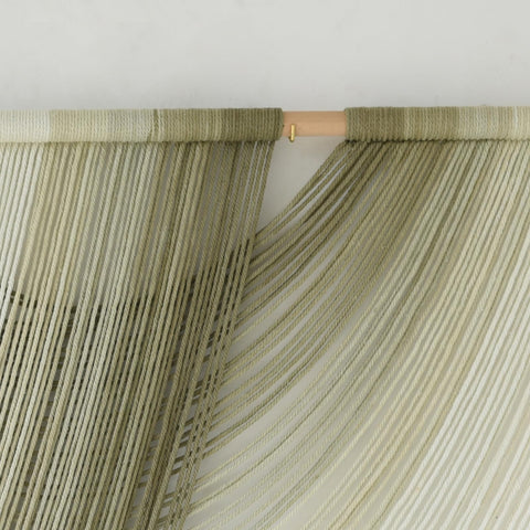 Flber boho wall decor 57-inch elevates living rooms and bedrooms.