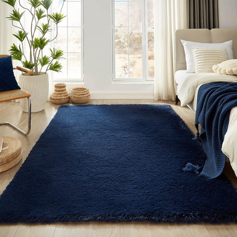 Floralux 5x7 dark blue area rug enhances spaces with rich color and definition.
