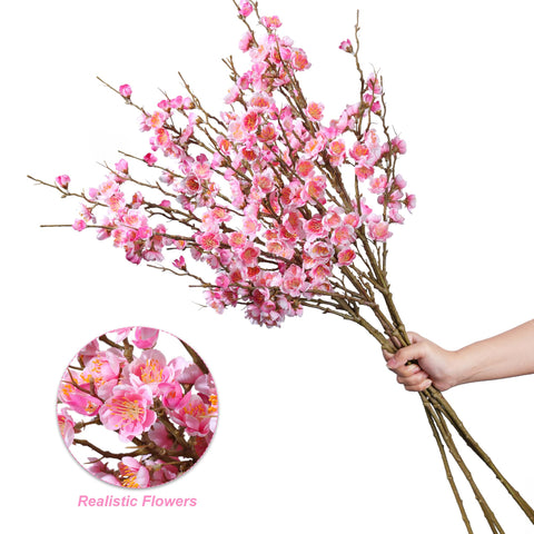Florisso pink cherry blossom branch used for wedding centerpiece and backdrop.