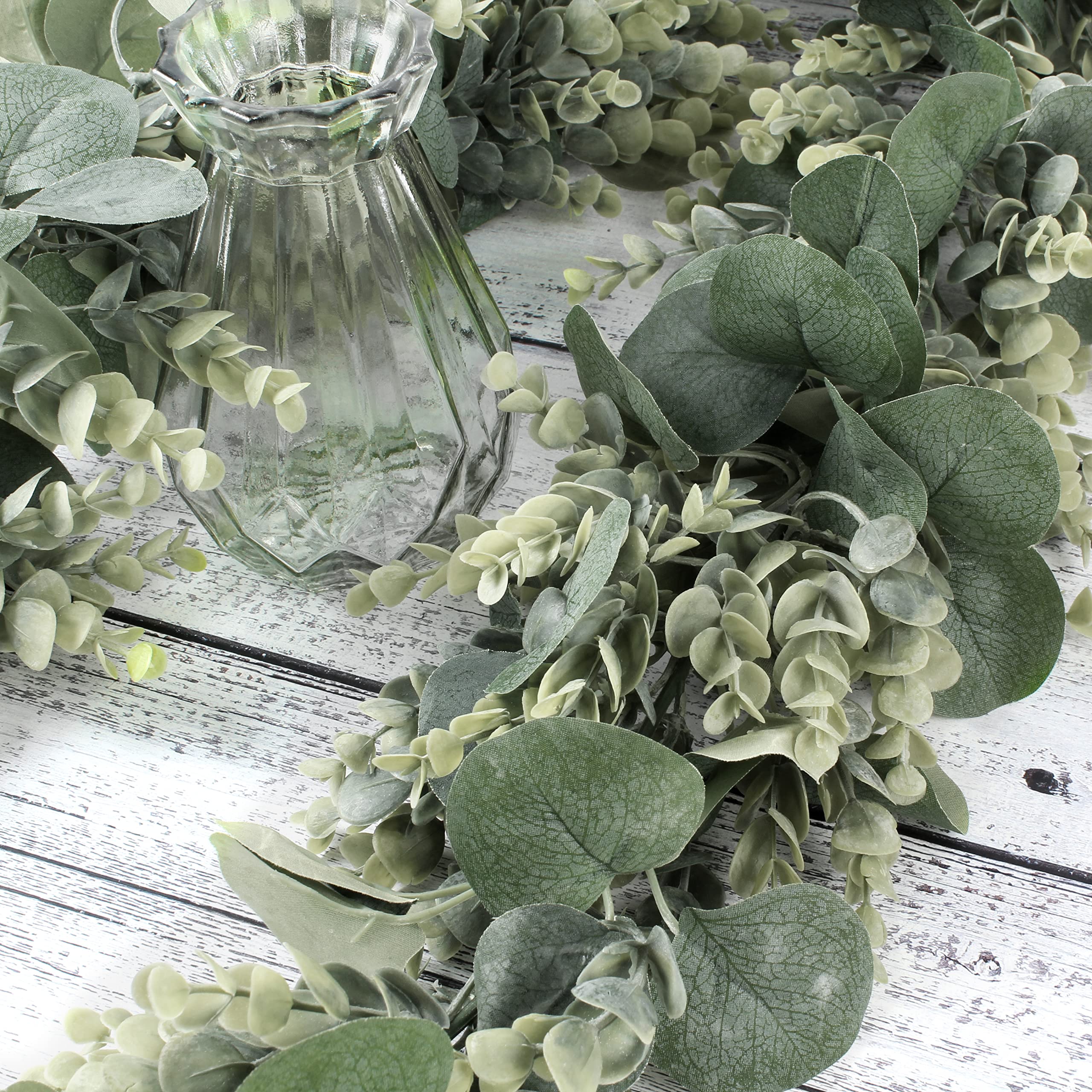 Florlab greenery garland closeup showcases silk leaves and wood-like stems