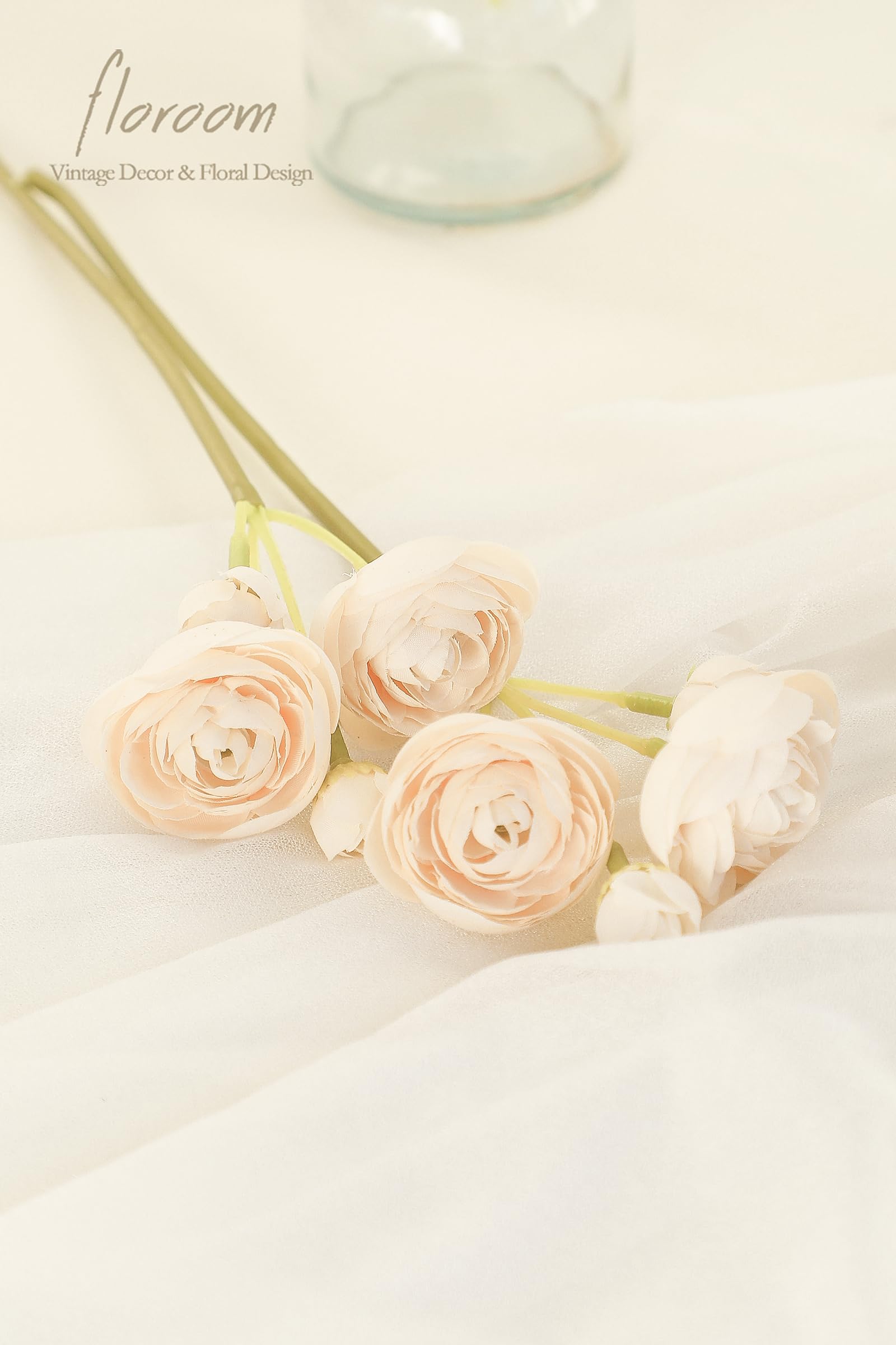 Floroom champagne ranunculus arrangement enhances bridal shower decorations with natural-looking blooms.