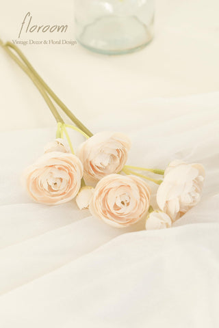 Floroom champagne ranunculus arrangement enhances bridal shower decorations with natural-looking blooms.
