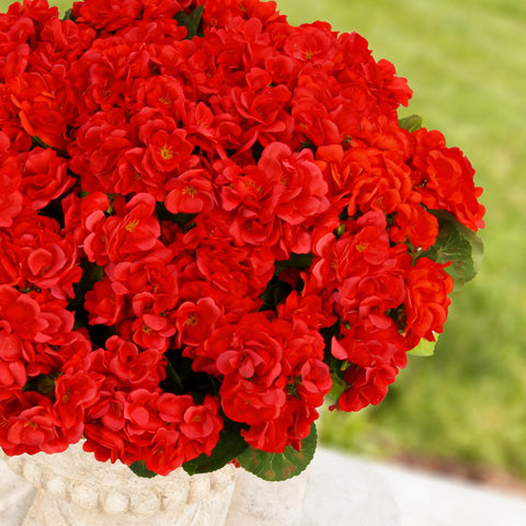 Flortevera basket and planter display with artificial geraniums