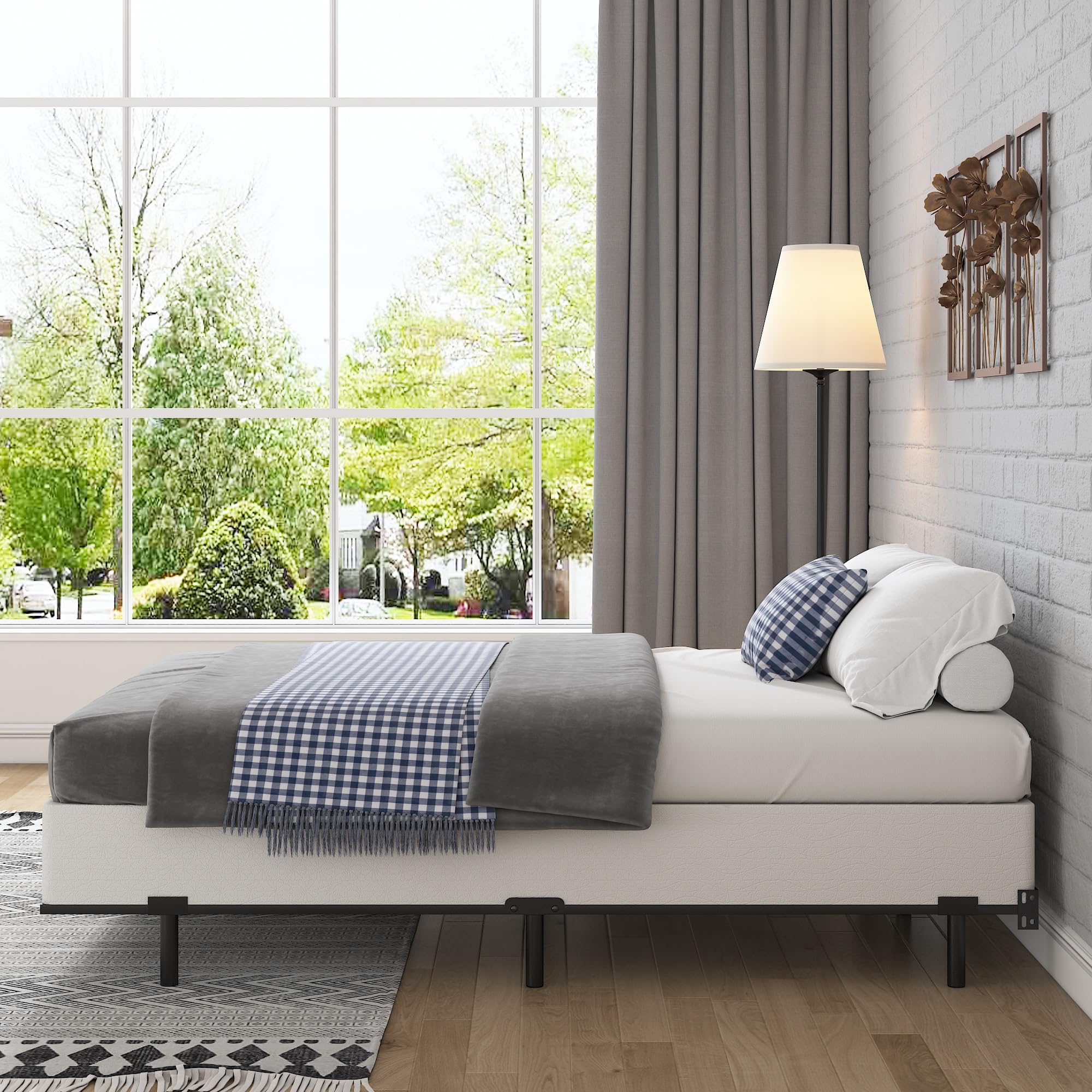 Bedroom scene with bed elevated by FMDMR box spring and tidy appearance
