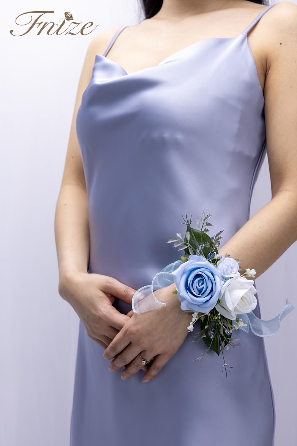Fnize blue wrist corsage strap showing secure, adjustable fit