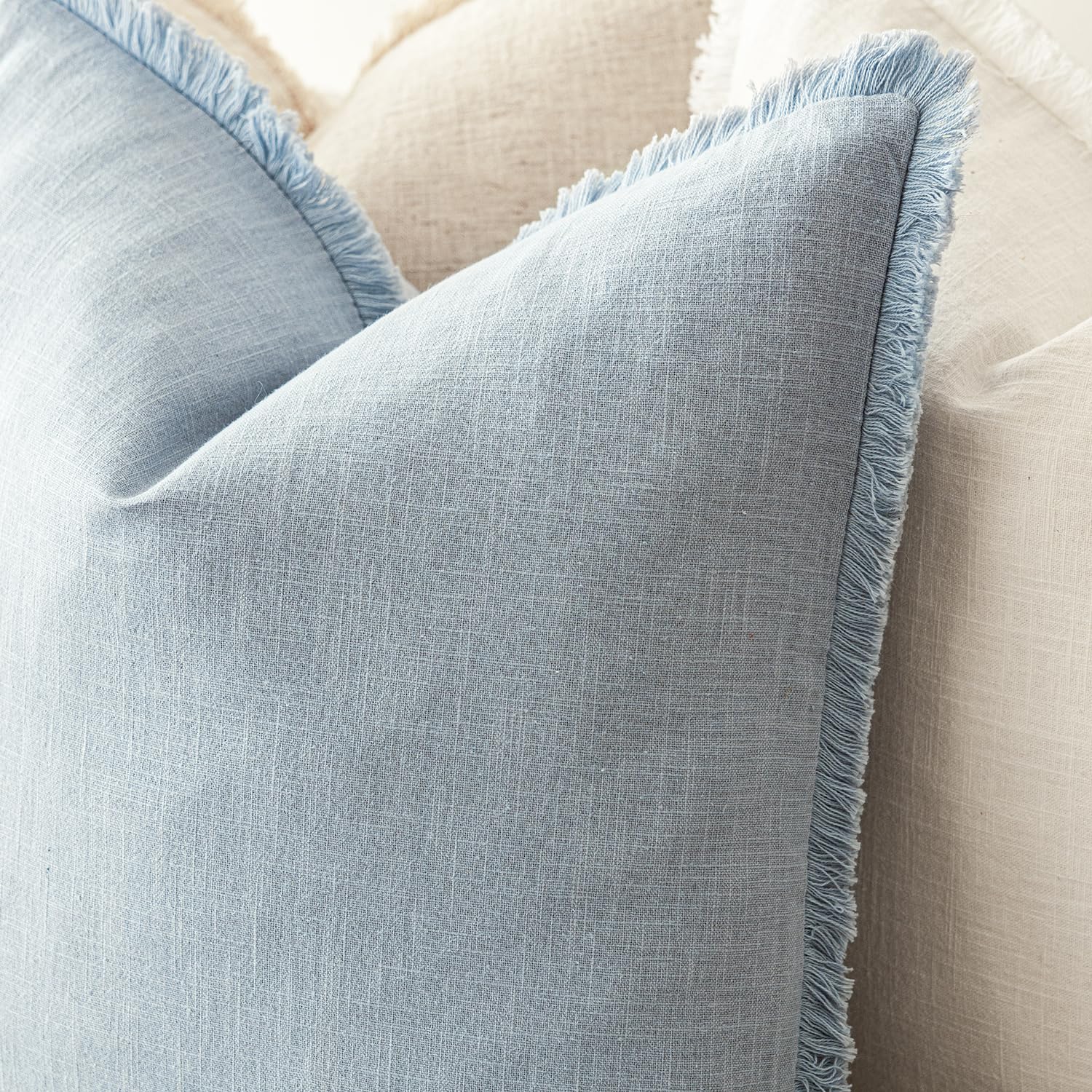 Foindtower 24x24 inch cover displayed on sofa for layered decor
