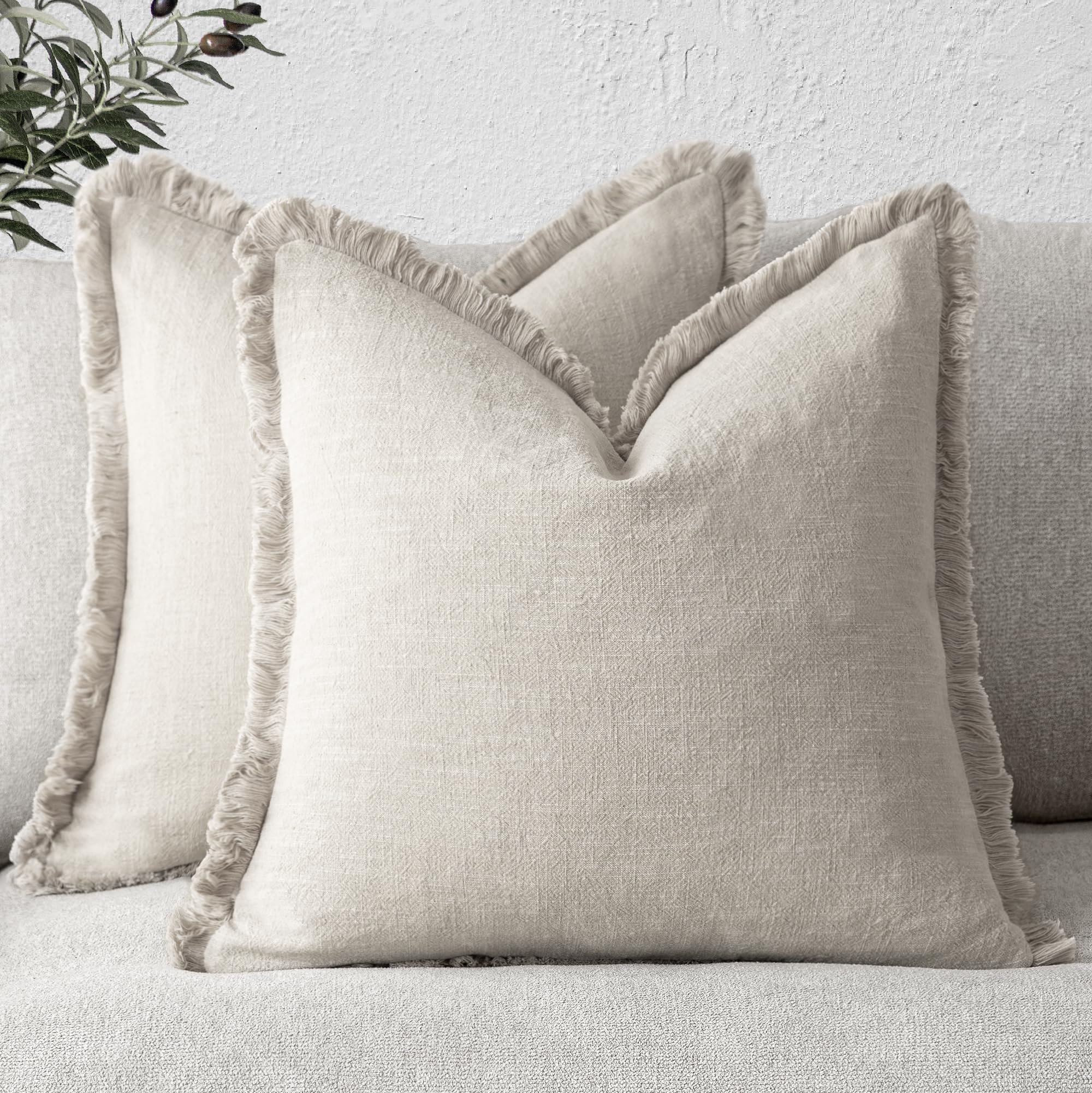 Foindtower fringe pillow cover beige adds soft texture to living room.