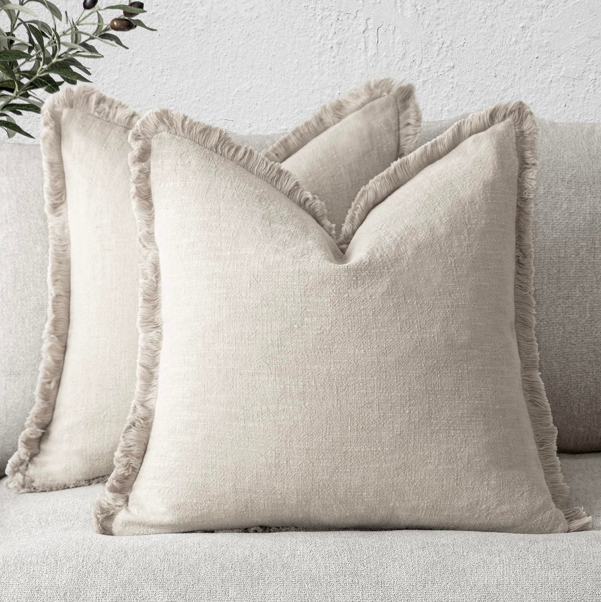 Foindtower fringe pillow cover beige adds soft texture to living room.