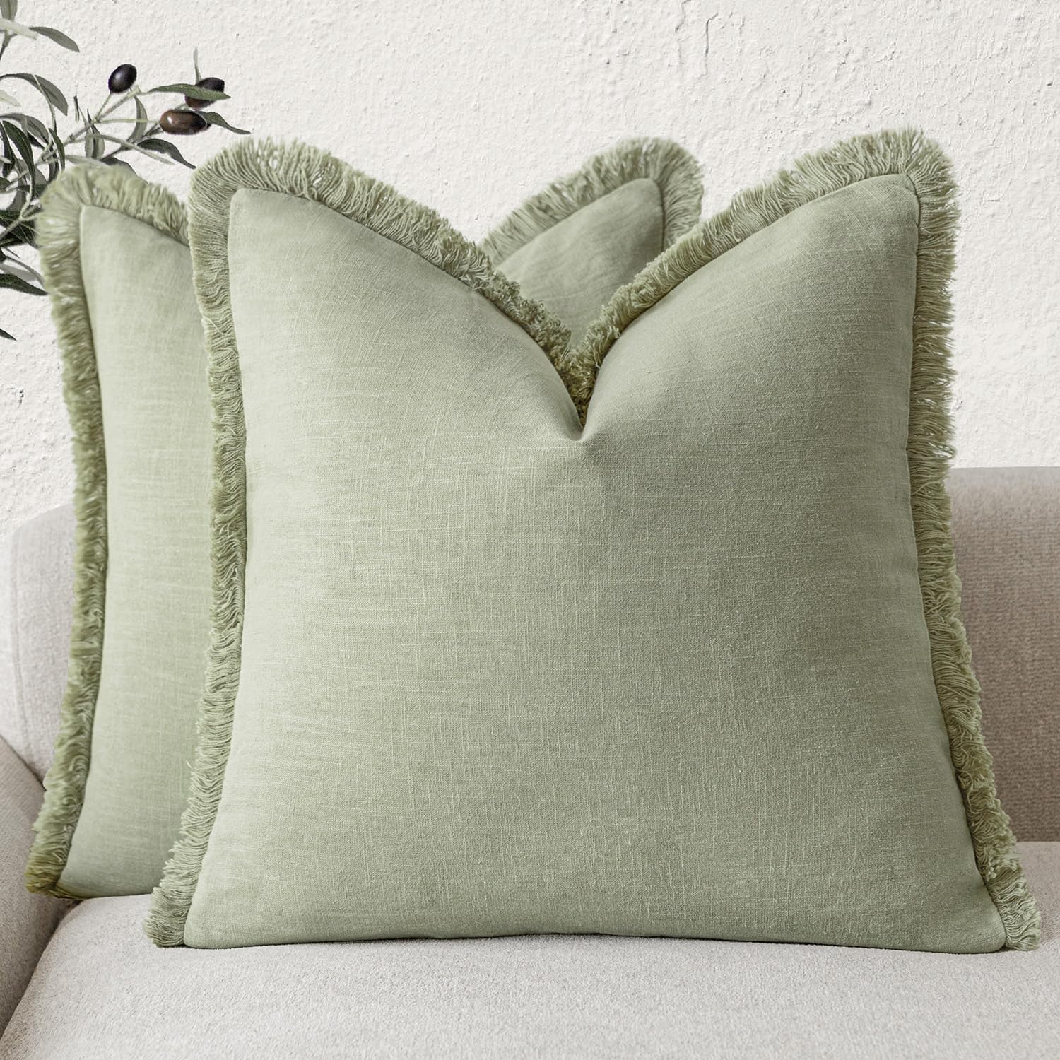Foindtower linen fringe pillow cover in light sage adds Boho charm and breathable texture.