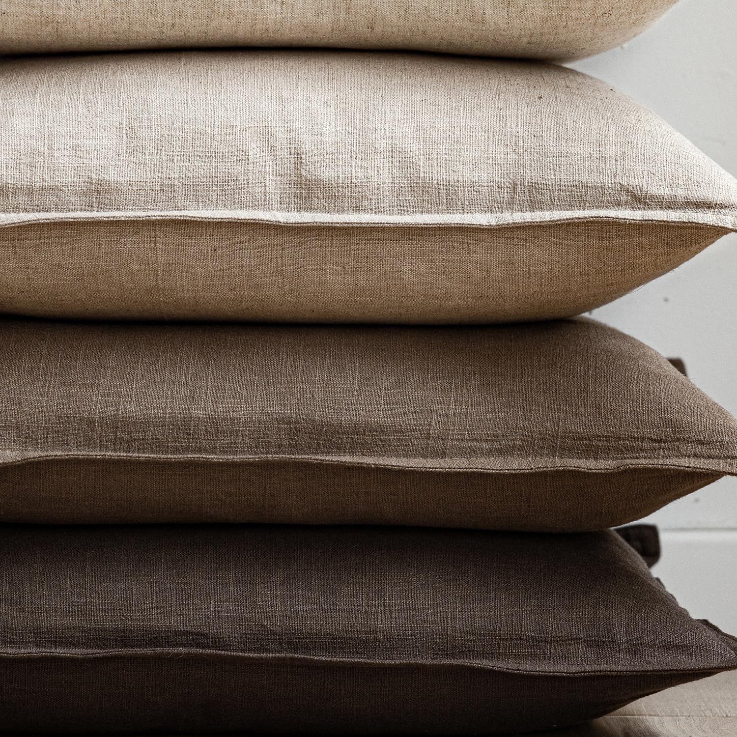 Foindtower outdoor-ready pillow cover for patio seating in sunshine.