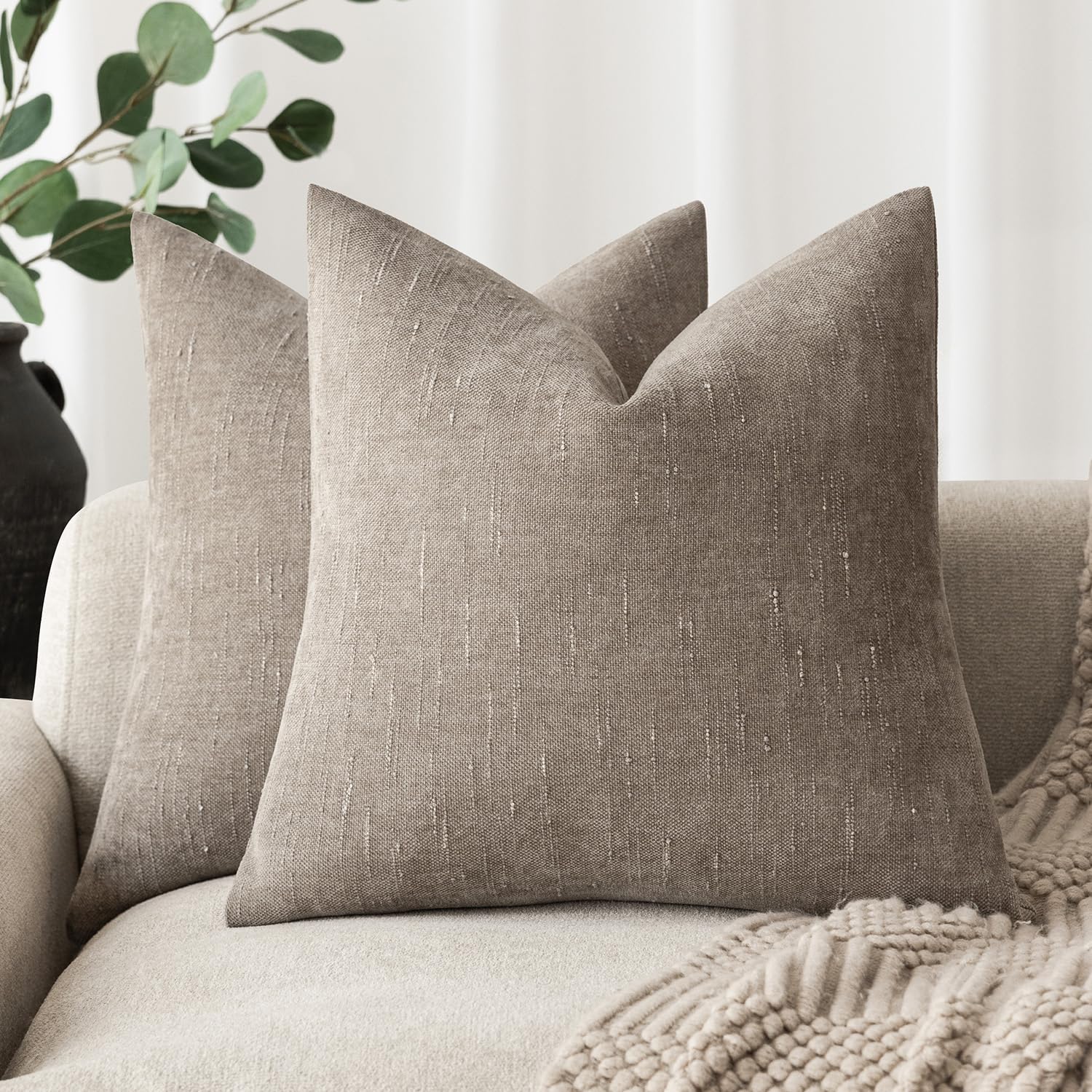 Foindtower soft chenille pillow cover in light taupe adds plush texture to living room.