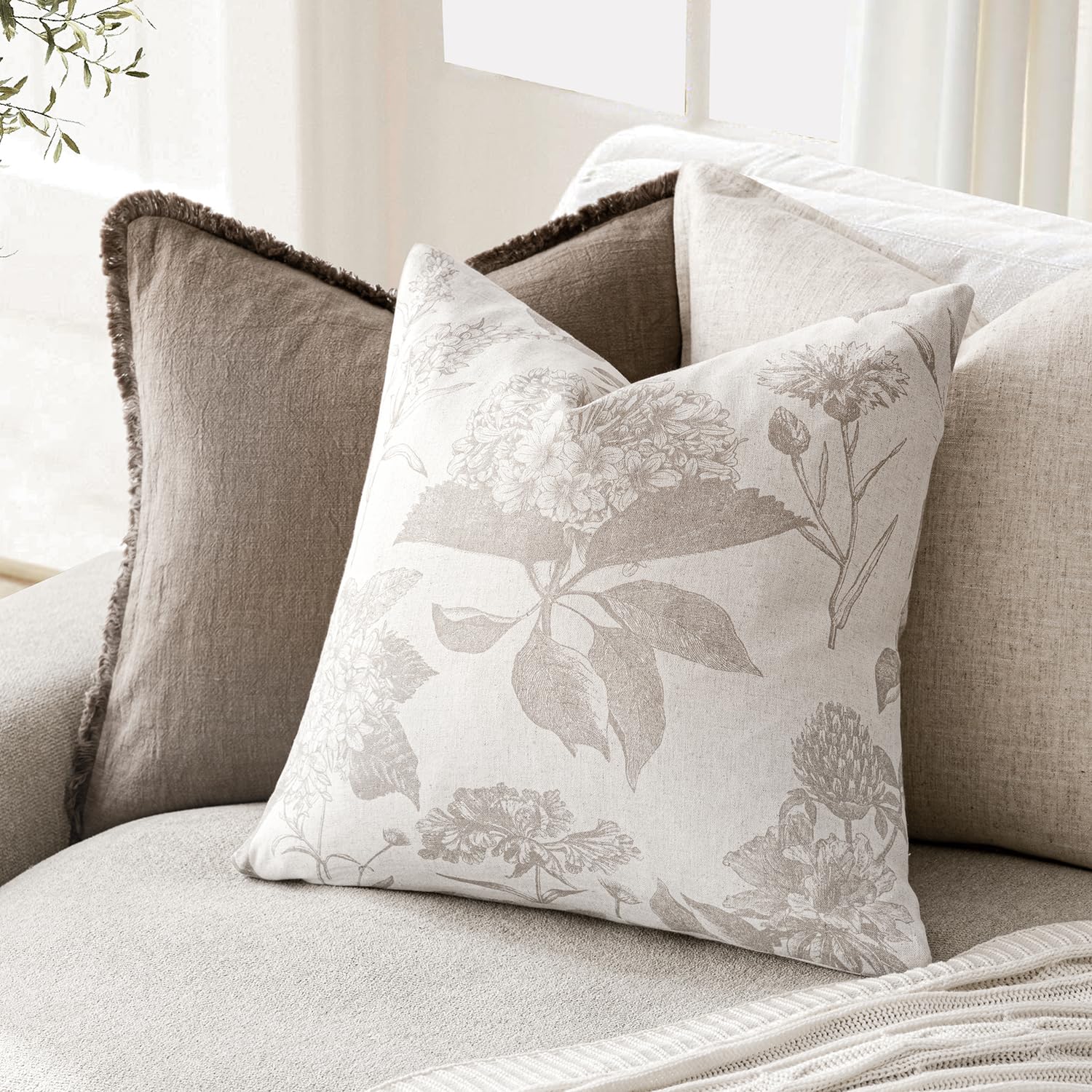 Foindtower two pillow covers on a sofa inspire cozy farmhouse styling.
