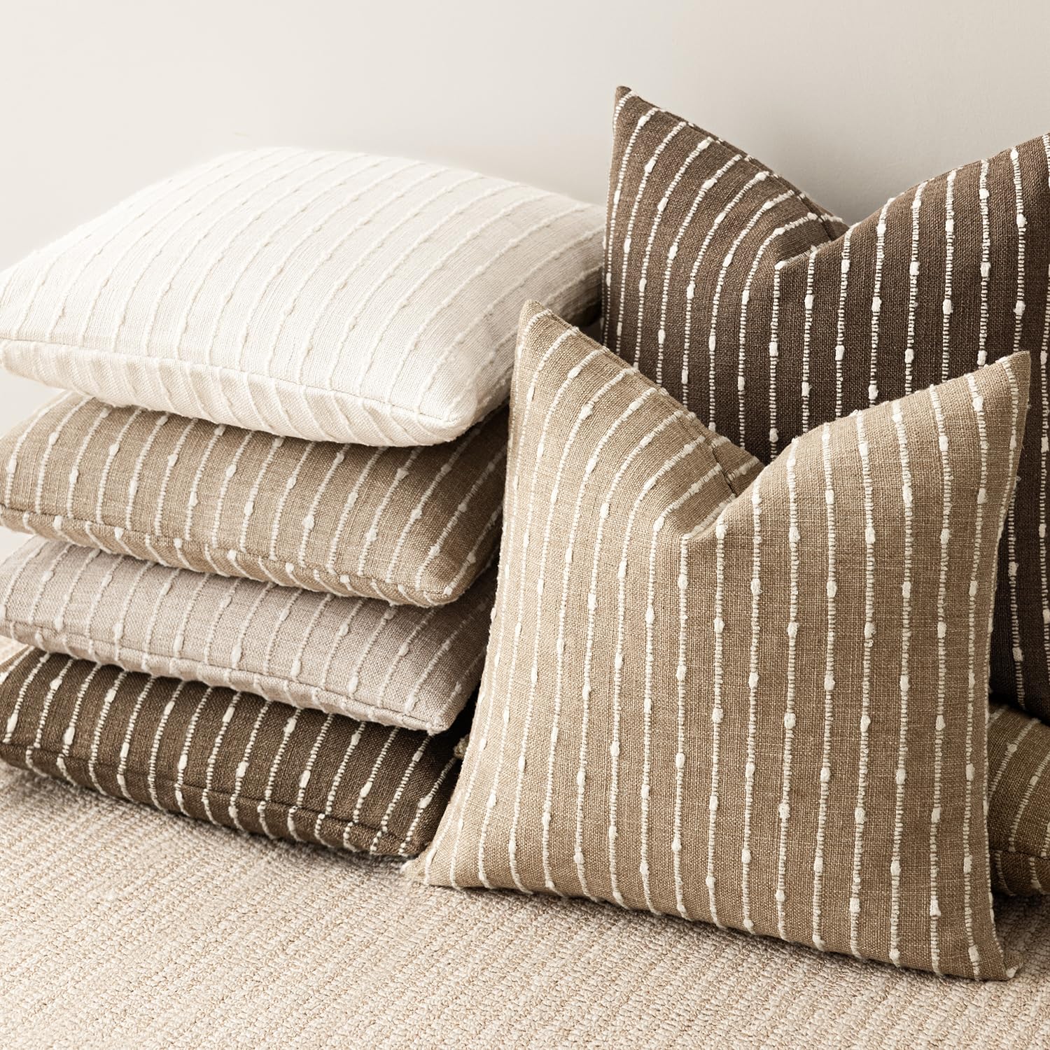 Foindtower versatile cushion cover complements neutral palettes in seating areas.