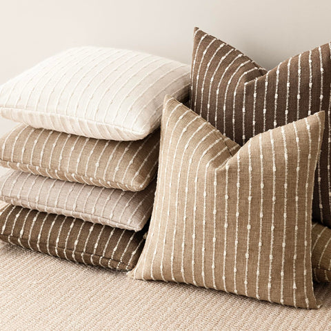 Foindtower versatile cushion cover complements neutral palettes in seating areas.