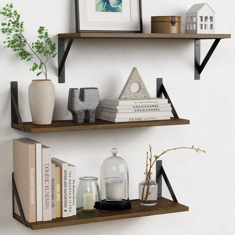 Forbena 24-inch floating shelves set of 3 display plants on a bedroom wall.