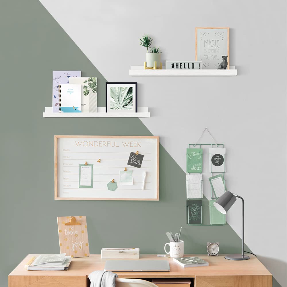 Forbena nursery shelf with lip holds picture frames and small mementos.