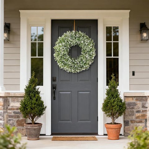 FOTEEWL artificial boxwood wreath on fireplace mantel adds natural texture.