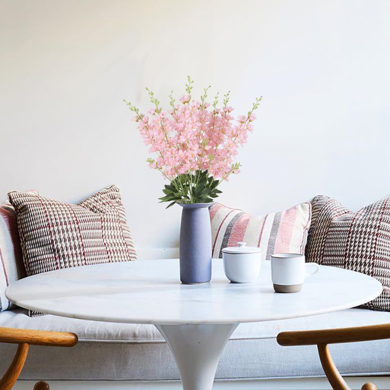 Fqueelvys living room decor with pink delphinium adds vertical interest.