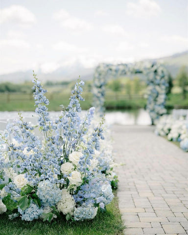 Fqueelvys dusty blue delphinium in a cafe or storefront floral display