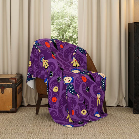 Franco Coraline button eyes throw showcases button motif for cozy movie-night ambiance