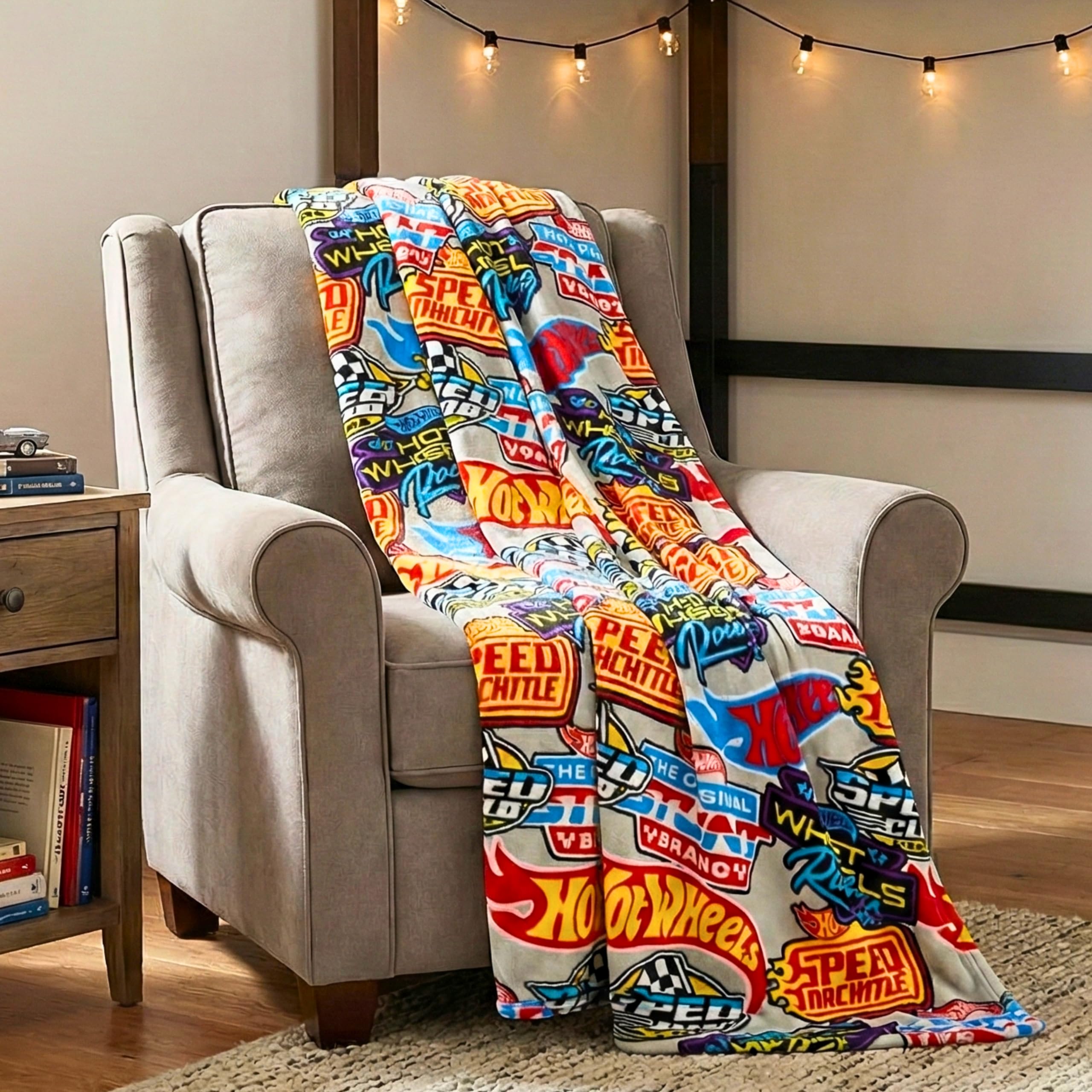 Franco Hot Wheels throw blanket close-up of racing logos for cozy moments