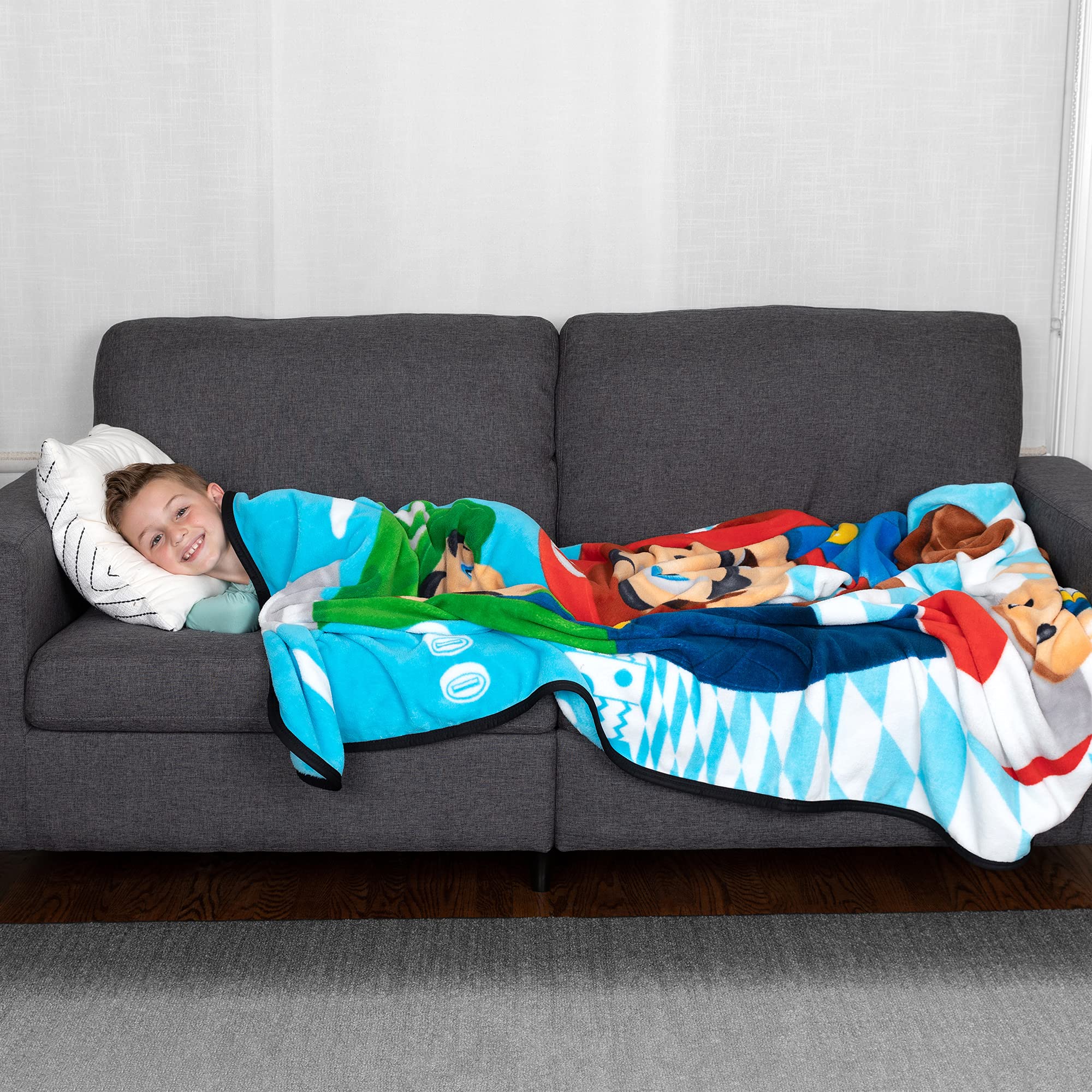 Franco Mario Game Kings blanket back highlights blue and white backdrop for easy styling