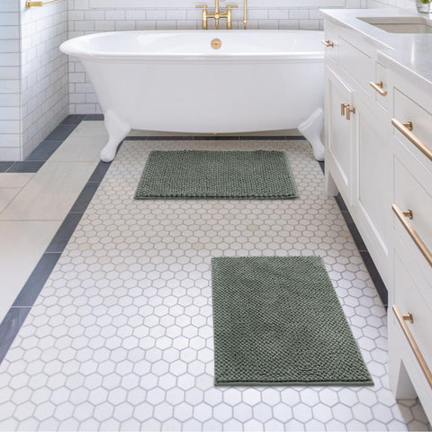Freshmint sage-green rug enhances bathroom decor with plush texture.