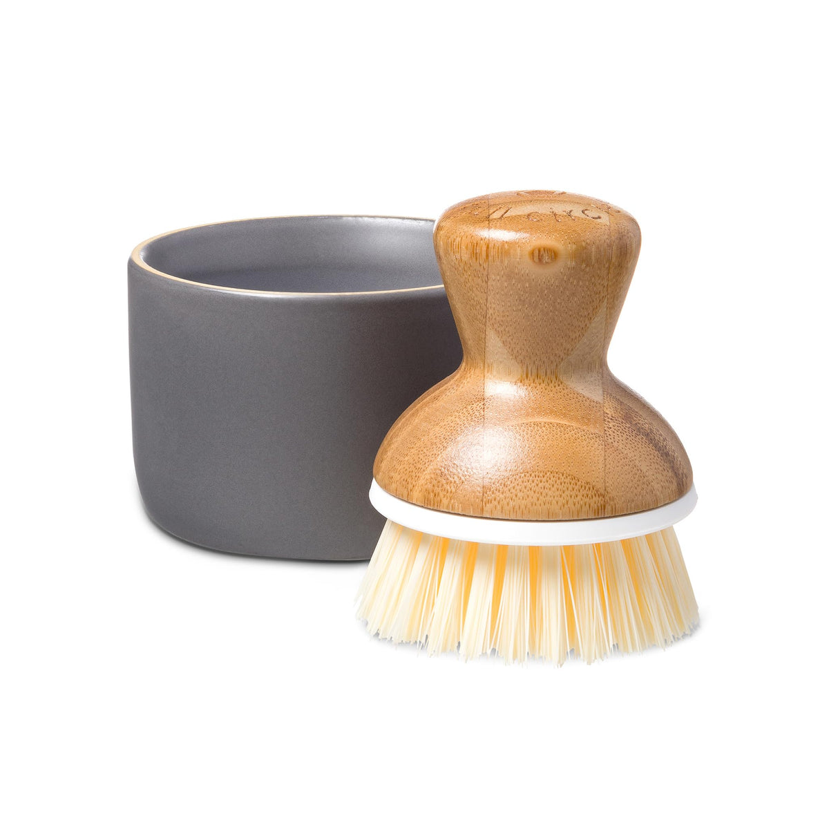 Full Circle Bubble Up dish brush with ergonomic bamboo handle for effortless scrubbing.