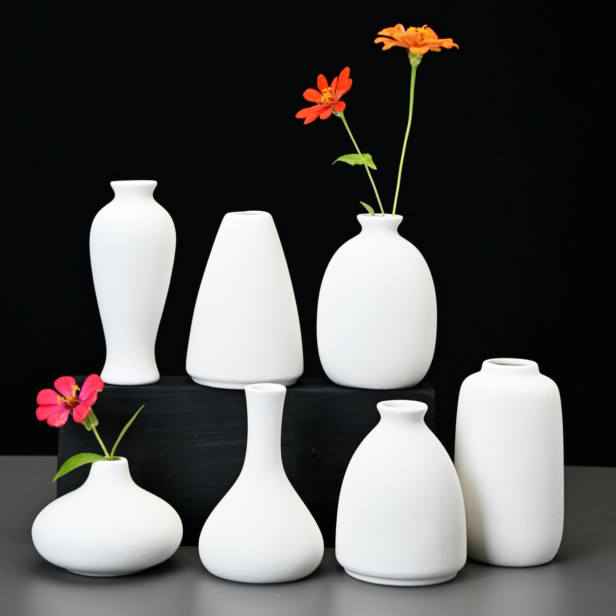 Fulloog bud vase asymmetric design adds visual interest to tablescape.