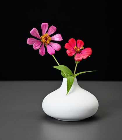 Fulloog bud vase round silhouette adds rustic charm to arrangements.
