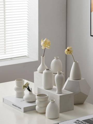 Fulloog bud vase small flared opening fits single stems gracefully.