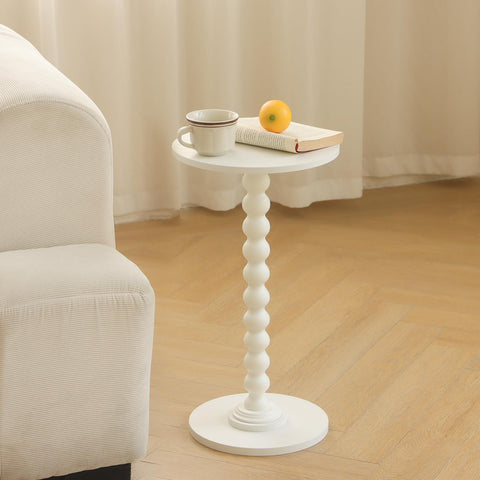 Fultyle white round table features walnut-grain finish and wood ball connector leg